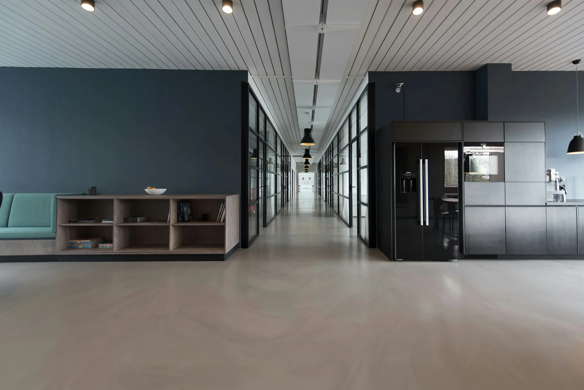 Bright, finished commercial interior with a long corridor
