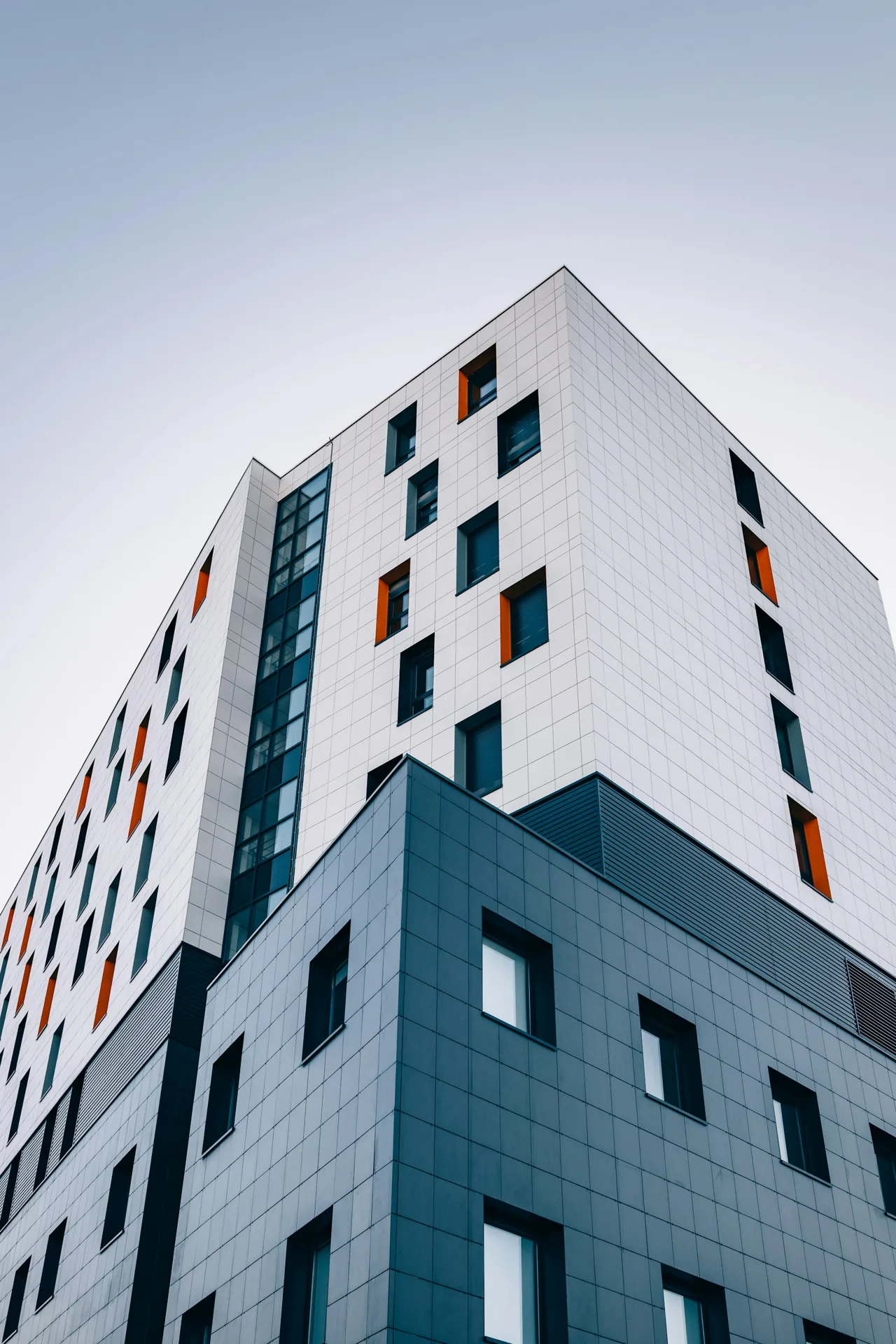 White residential tower against the sky